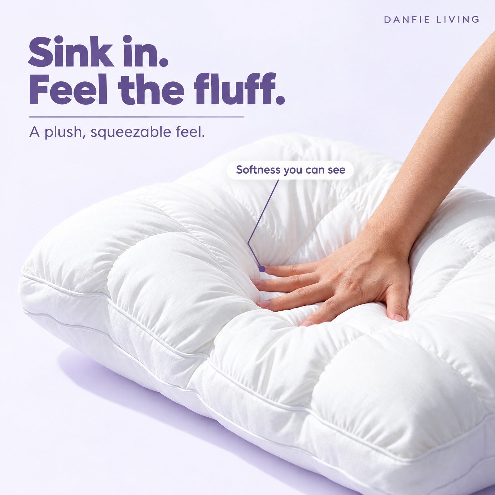Hand pressing deeply into a soft white puff-grid pillow